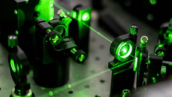 Green laser beams in a futuristic device