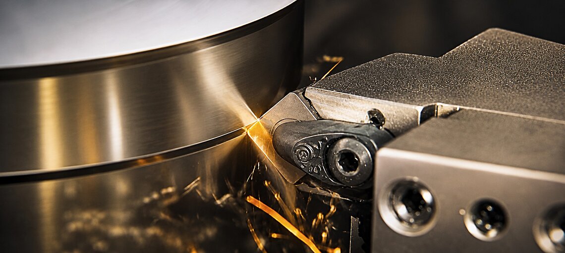 A ceramic cutting insert in use during turning