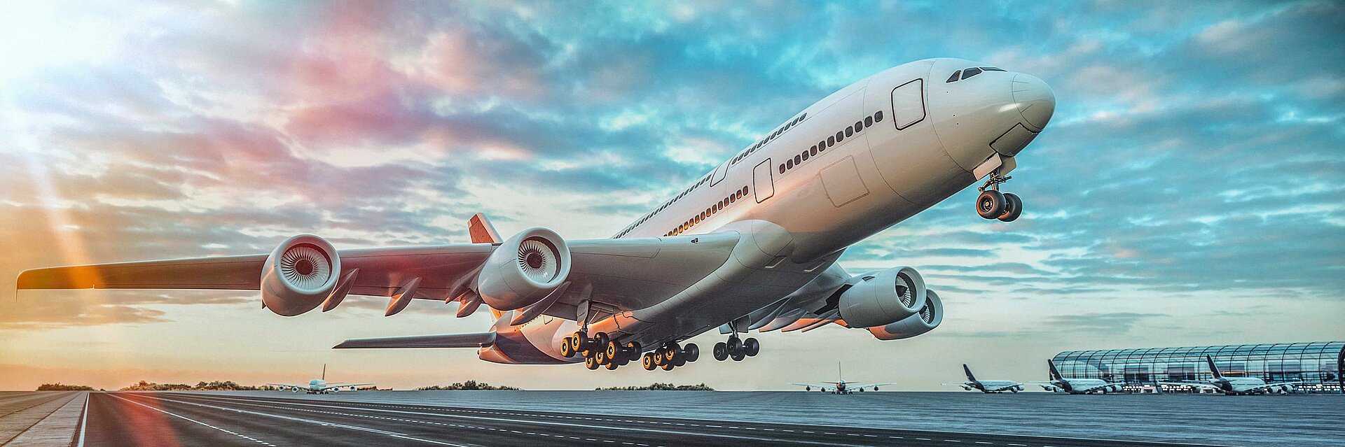 An aeroplane takes off at sunrise
