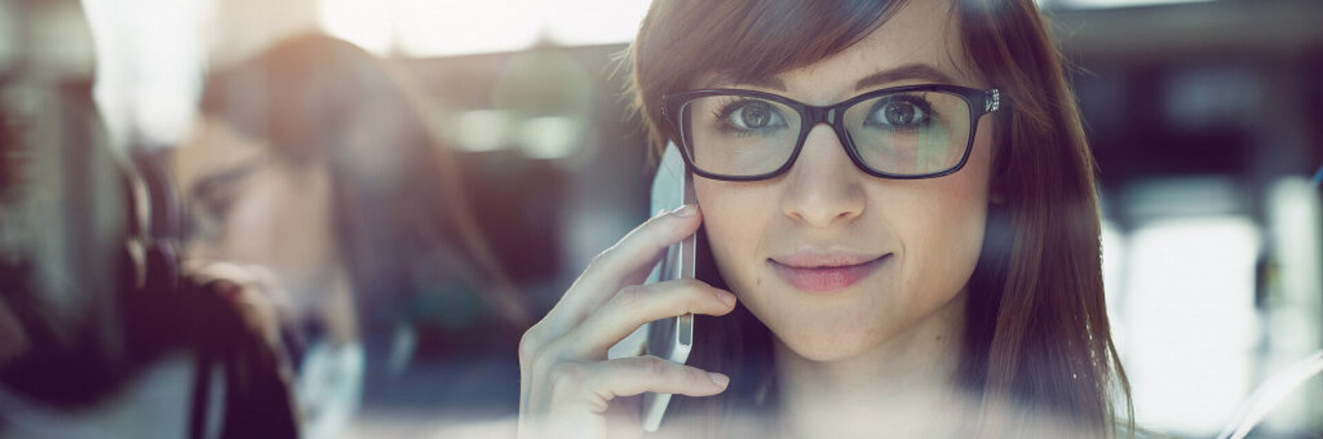 Woman smiling while talking on phone 