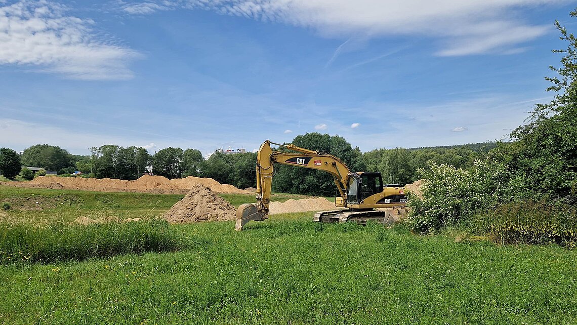 Excavator starts construction on a greenfield site