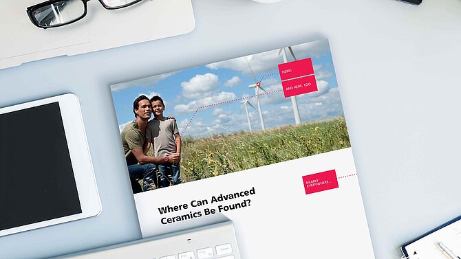 A CeramTec brochure lies on an office desk