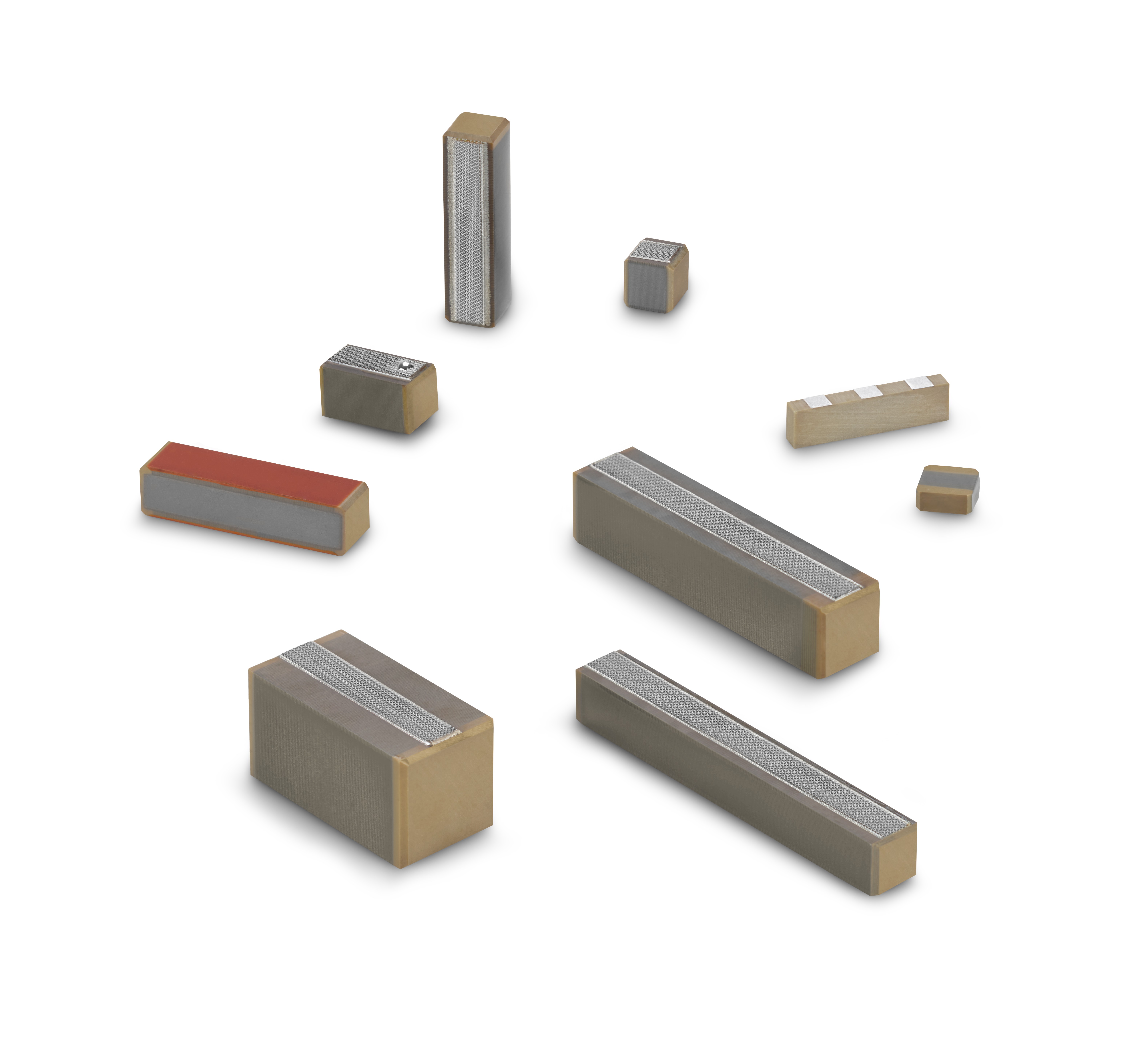 Various monolithic multilayer actuators from CeramTec on a white background
